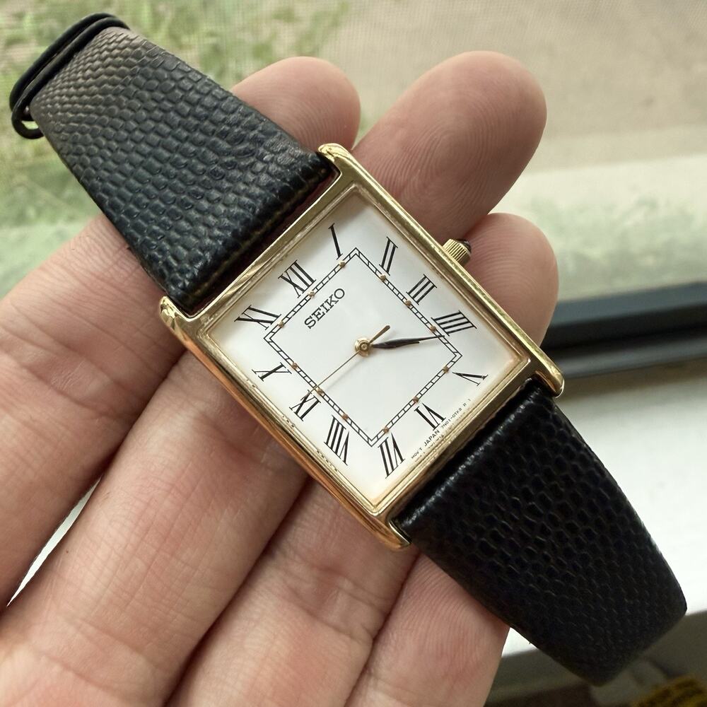 Seiko 7N01-0EZ0 Tank Rectangle Gold Tone Quartz Watch Black Leather Band 25MM